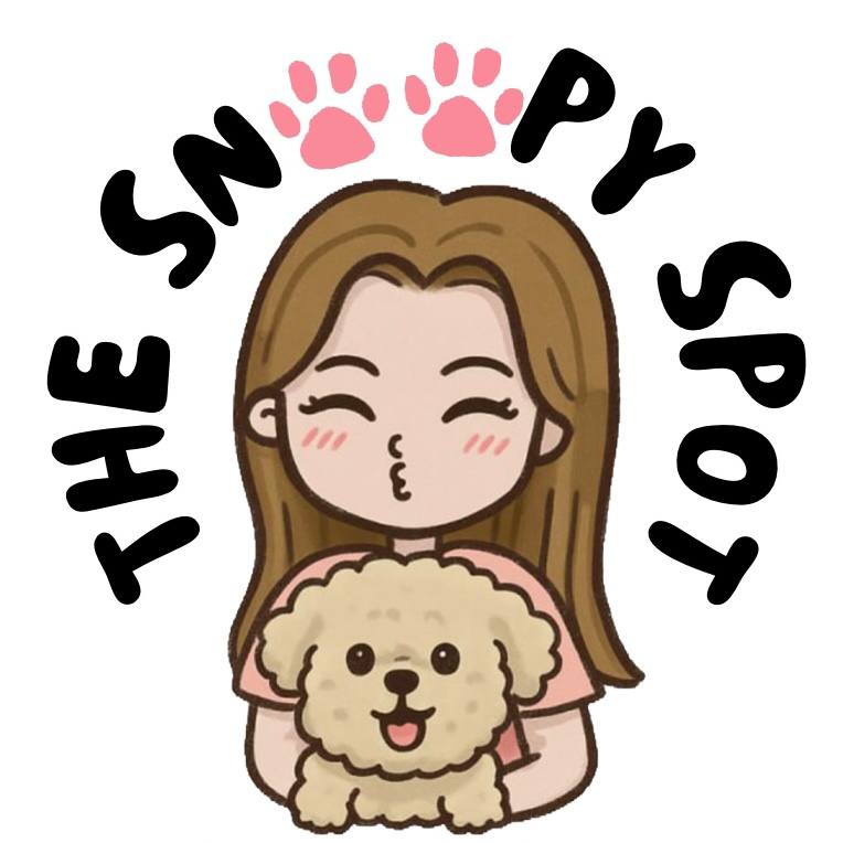 The Snoopy Spot logo: a groomer holding a happy dog